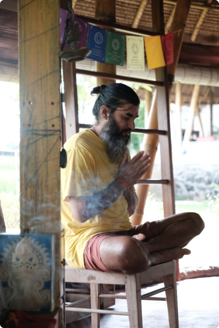A Vedic Path teacher seated in prayer