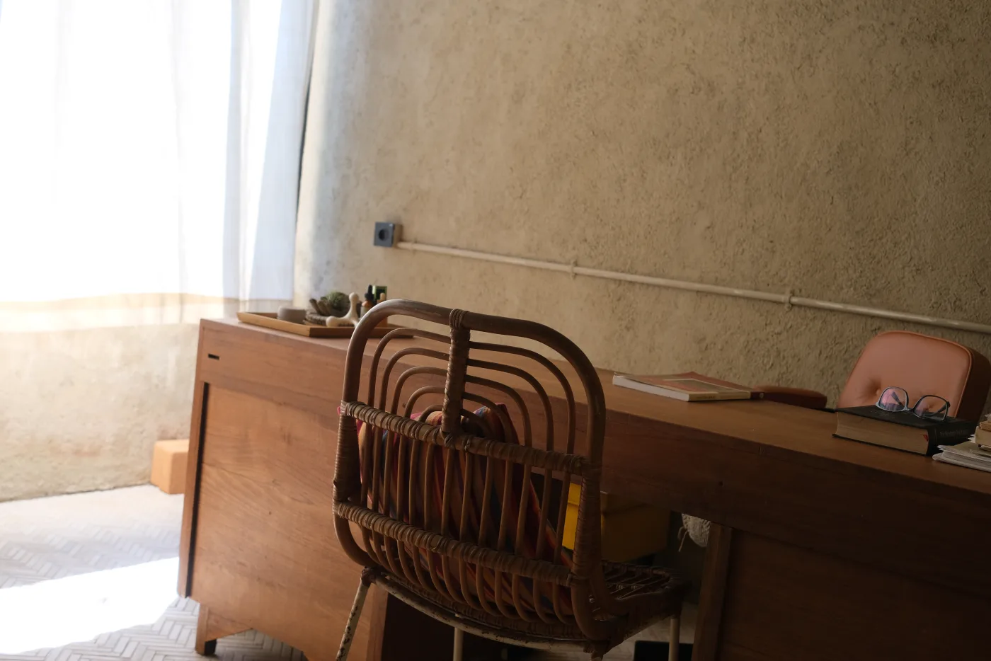 A quiet VedicPath consultation desk with books and a chair prepared for one-to-one counseling