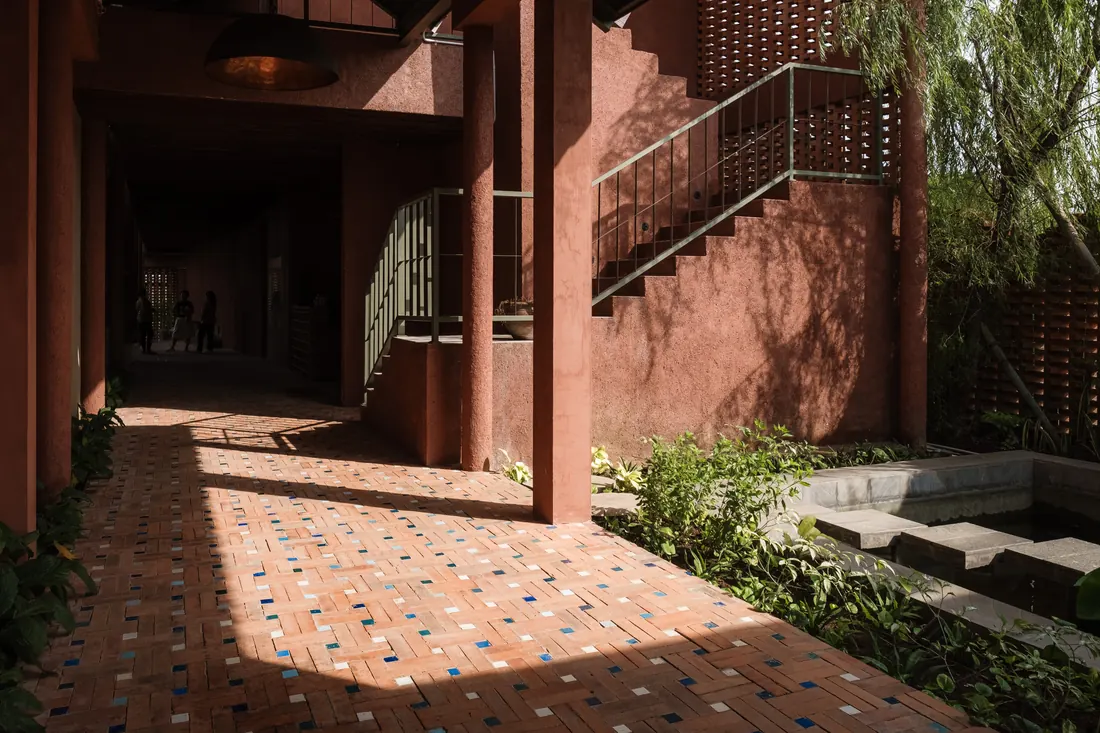 A quiet courtyard and shared table inside VedicPath Bali