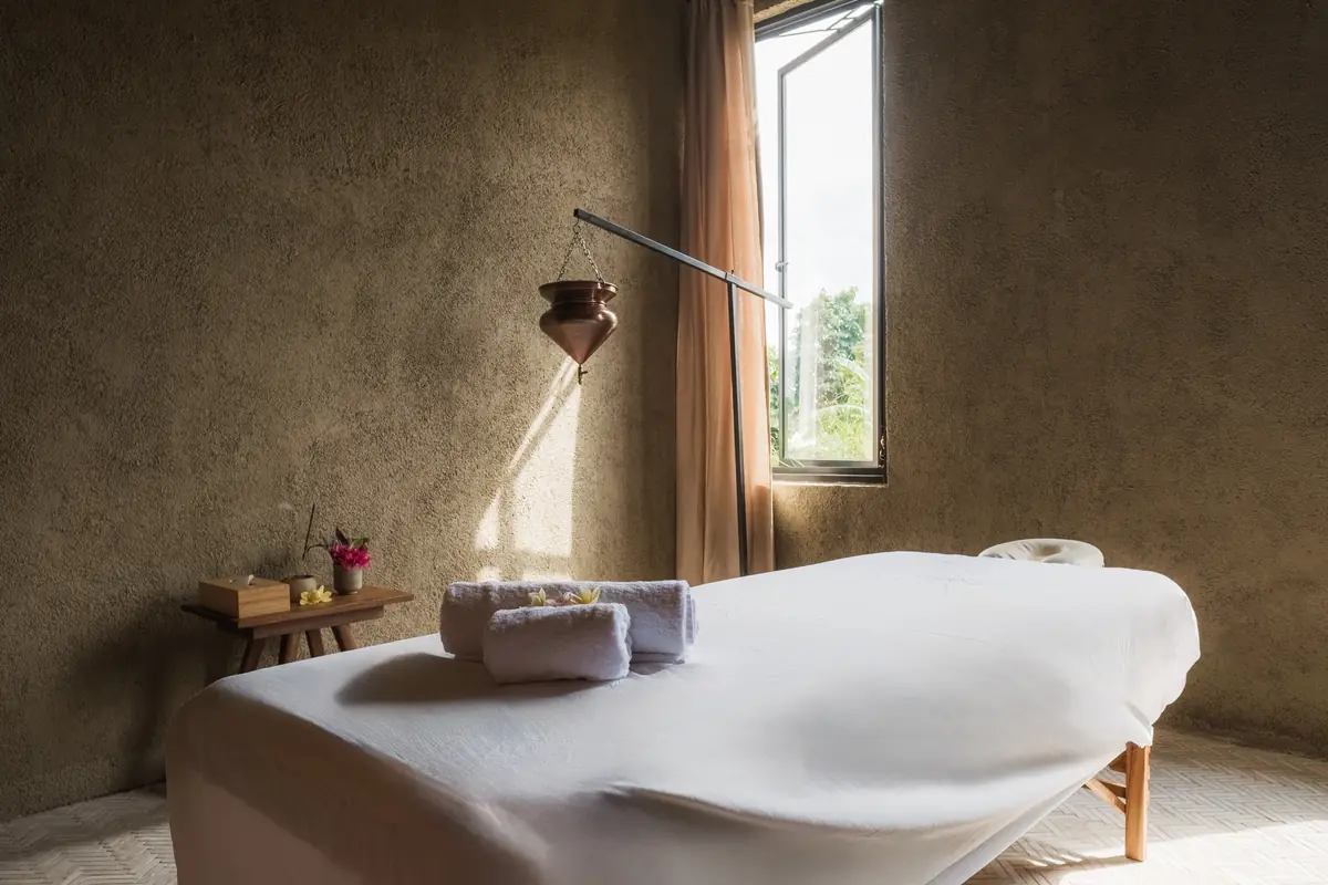 Morning light falling across a prepared Vedic Path treatment room